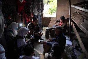 Keris craftsmen are teaching visitors about the process of making keris in the workshop. Bantul, Indonesia - 25 August 2022 photo