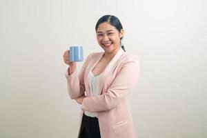 Asian woman with hand holding coffee cup photo