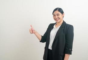 Asian woman with thumb up white background photo