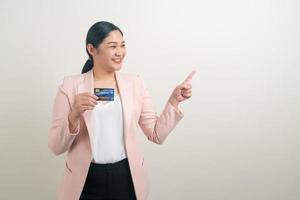 Asian woman holding credit card with white background photo