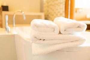 white towel on bath tub photo