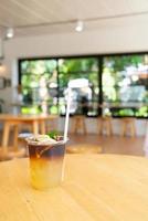 lemon with black coffee in glass photo