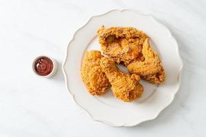 fried chicken with ketchup on plate photo