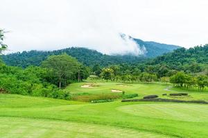 Green with Sand bunkers on Golf course photo