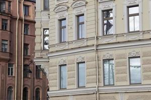 Parts of retro houses with windows.Building with windows. photo