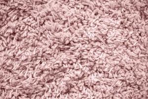 Pink fur background. Fluffy soft fur.Fluffy piece of cloth photo