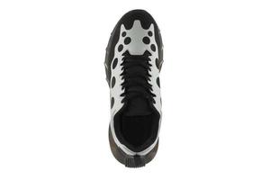 Black sneakers with white inserts isolated on white background. photo