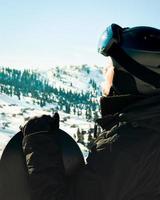 Close up portrait guy holding snowboard in winter, sports wear, helmet, sunglasses, winter, up, freedom, nature, attractive, clothes, sport, competitions, winter holidays, alps photo