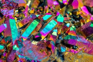 Macro mineral stone Titanium Quartz, Flame Aura Quartz on a white background photo