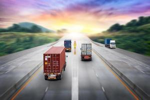 Truck transport with red container on highway road at sunset, motion blur effect, logistics import export background and cargo transport industry concept photo