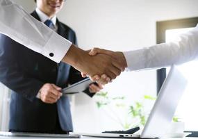 Two executives handshake as partners after the successful meeting. photo