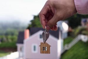 Landlord unlocks the house key for new home photo