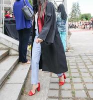 university graduating students are having a photo shooting in the park