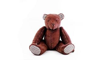 Brown teddy bear doll sitting isolated on white background,teddy bear doll photo