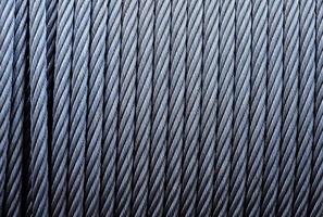 Coiled industrial cabling.Background of galvanized metal cable on the winch,Industrial wire roll background photo