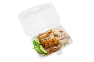 Hainanese Chicken Rice ,fried chicken in foam box on white background photo