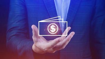Hands holding virtual US dollar icon. USD is main exchange currency in the world, monetary growth, interest rate increase, inflation concept, Interest rate financial and mortgage rates concept photo