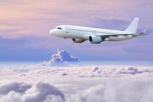 plane in the sky, Passenger commercial plane flying above the clouds ,concept of fast travel, vacation and business. photo