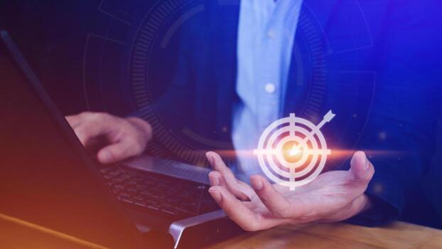 Targeting concept with businessman hand holding digital image of dartboard,Businessman holding virtual dartboard and arrow with copy space for setup business objective target concept. photo