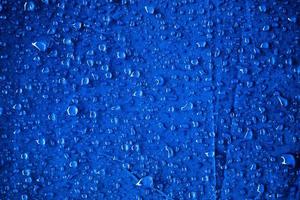 Water drops on the blue fabric.water drops on blue background photo