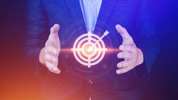 Targeting concept with businessman hand holding digital image of dartboard,Businessman holding virtual dartboard and arrow with copy space for setup business objective target concept. photo