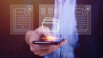 Document Management System DMS being setup IT consultant working on smartphone. Software for archiving, searching and managing corporate files information photo