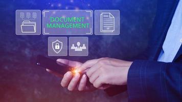 Document Management System DMS being setup IT consultant working on smartphone. Software for archiving, searching and managing corporate files information photo