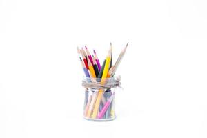 Pencils in glass bottles on white background,back to school background photo