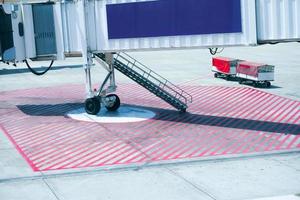 Empty jet bridge or passenger boarding bridge at an airport photo