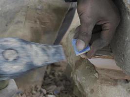 Moroccan Craftsman painting and decorating ceramic products in pottery factory in Fez, Morocco photo