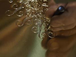 Fez Morocco Metal craftsman making copper trays photo