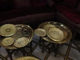 Fez Morocco Metal craftsman making copper trays photo