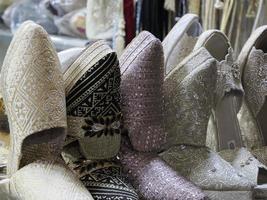 bride festive shoes Colorful handmade leather slippers waiting for clients at shop in Fes, next to tanneries, Morocco photo