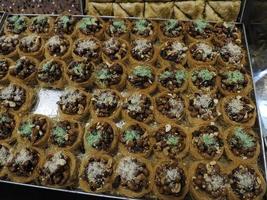 Moroccan biscuits and pastries dipped in honey for sale in the Medina of Fes in Morocco photo