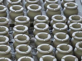 Moroccan Craftsman painting and decorating ceramic products in pottery factory in Fez, Morocco photo