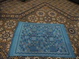 Moroccan handmade carpet at a shop in Medina of Fez, Morocco. photo