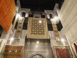 Moroccan handmade carpet at a shop in Medina of Fez, Morocco. photo