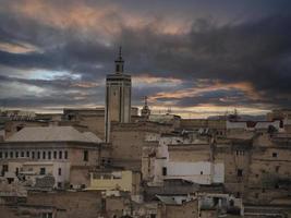 Aerial sunset view panorama of the Fez el Bali medina Morocco. Fes el Bali was founded as the capital of the Idrisid dynasty between 789 and 808 AD. photo