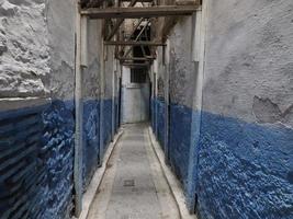 Blue Small street in Fez medina old town. Morocco. photo