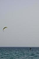 windsurfing, kitesurfing, water and wind sports powered by sails or kites photo