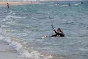 windsurfing, kitesurfing, water and wind sports powered by sails or kites photo