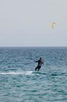 windsurfing, kitesurfing, water and wind sports powered by sails or kites photo