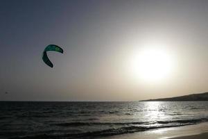 windsurfing, kitesurfing, water and wind sports powered by sails or kites photo