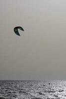 windsurfing, kitesurfing, water and wind sports powered by sails or kites photo