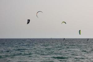 windsurfing, kitesurfing, water and wind sports powered by sails or kites photo