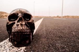 Skull miniature on the road photo