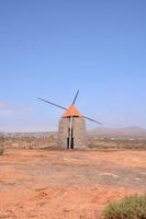 Traditional windmill under clear blue sky photo