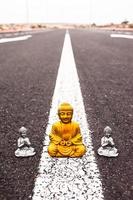 Buddha miniature on the road photo