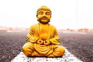 Buddha miniature on the road photo