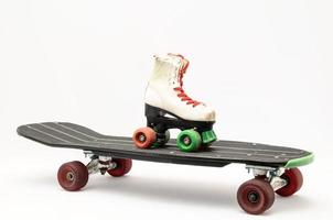 Skateboard and roller skates photo